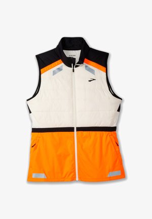Gilet léger avec un corps rembourré blanc, une section d'épaule noire et une partie inférieure orange vif. Accents réfléchissants et poches zippées inclus.