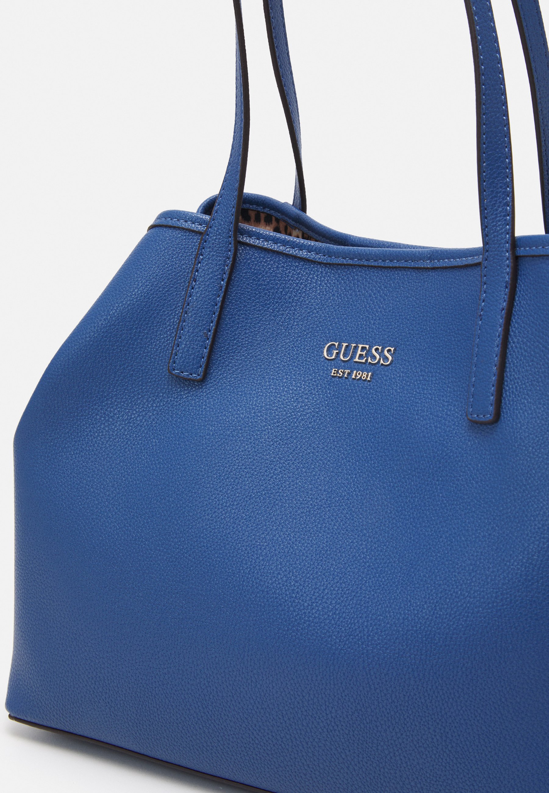 guess blue handbag