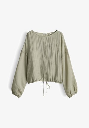 Blusa verde chiaro a maniche lunghe con scollo rotondo, vestibilità ampia, cintura in vita arricciata e sottili dettagli a texture verticale sulla parte anteriore.