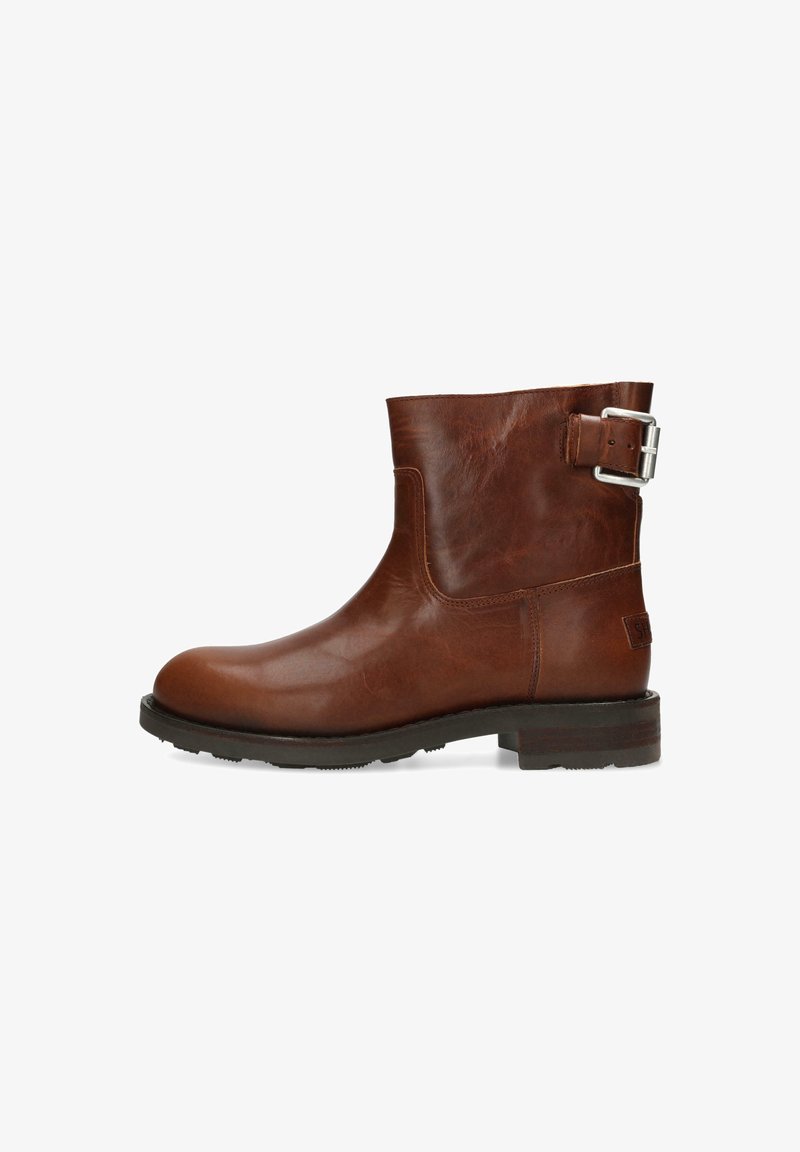 Brown leather ankle boot with a rounded toe, buckle detail on the side, textured finish, and a sturdy black rubber sole.