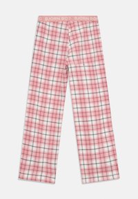 Rozā un baltas kvadrātveida taisnu kāju pidžamas bikses ar melnām līnijām un rozā jostu, uz kuras ir Björn Borg zīmols.