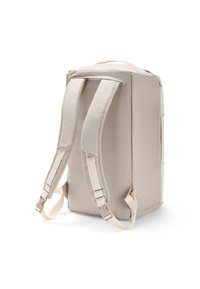Zaino beige con spallacci imbottiti e regolabili, forma strutturata e superficie in tessuto morbido. Design minimalista senza motivi visibili.