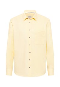 Camicia a maniche lunghe gialla chiaro realizzata in tessuto testurizzato, con chiusura frontale a bottoni, taschino sul petto e bottoni scuri.