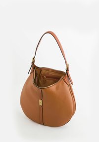 Tan leather handbag with a rounded shape, featuring a zippered top, gold hardware, and a smooth texture. Interior has a zip pocket.