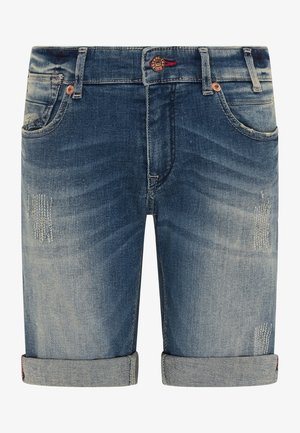 Džíny šortky ve vybledlé modré barvě, s ohrnutými okraji, drobným poškozením na přední části a detaily v měděném odstínu.