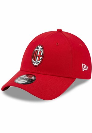 Red baseball cap with a rounded crown, embroidered AC Milan logo, adjustable closure, and a textured brim. Features a New Era sticker on the visor.