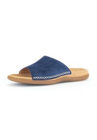 Navy suede slide sandal with an open toe, tan cushioned footbed, and contrasting white stitching along the side for detail.