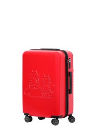 Red hard-shell suitcase with embossed cat design, black zipper, textured surface, and four black wheels for mobility.