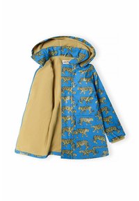 Modra jakna z vzorcem tigra, ki ima bež flisasto podlogo, kapuco in pritisne gumbe po sprednji strani in rokavih.