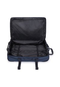 Navy blue wheeled suitcase with a black interior, featuring adjustable straps, a sturdy handle, and a zippered closure.