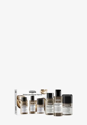 L'Oréal Professionnel Molecular Repair Haar Kit bevat vijf transparante flessen met zwart-witte etiketten, verpakt in een witte doos.