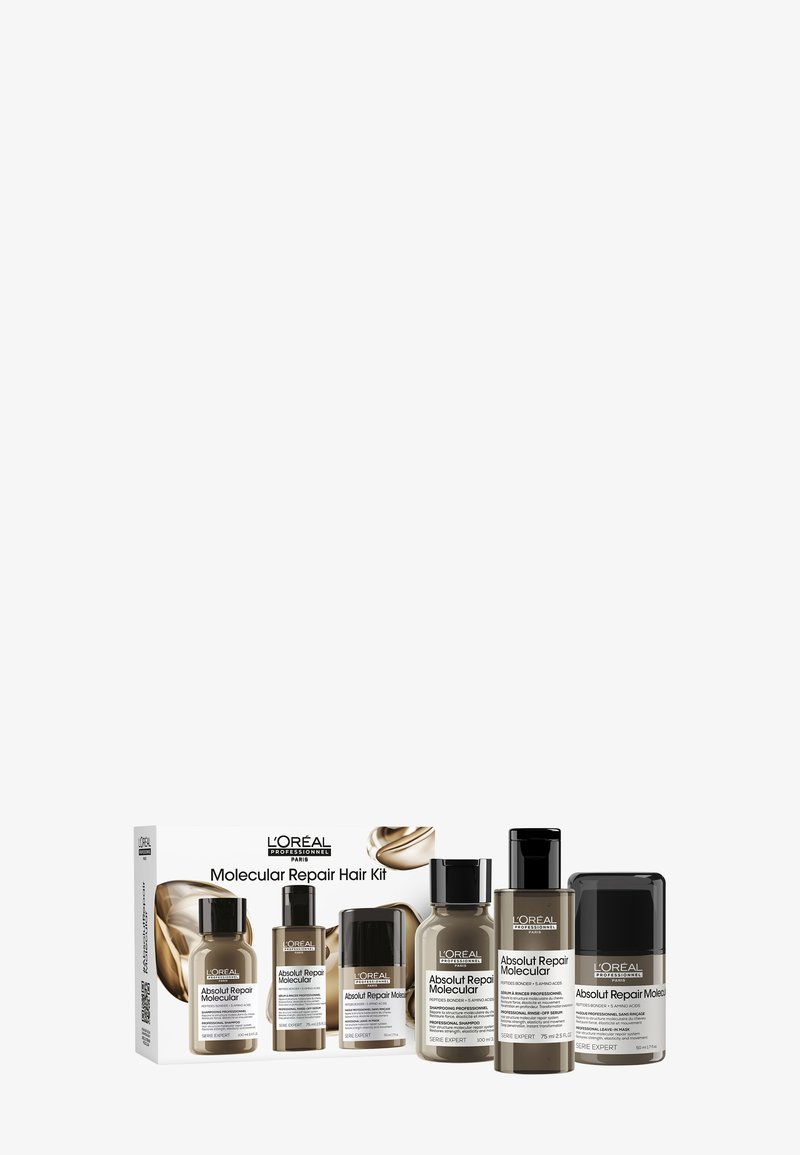 L'Oréal Professional Molecular Repair Hair Kit innehåller fem transparenta flaskor med etiketter i svart och vitt, förpackade i en vit låda.