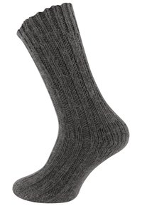 Calzino grigio lavorato a maglia con texture a coste, caratterizzato da un polsino ondulato, progettato per calore e comfort. Forma curvata per adattarsi al piede.