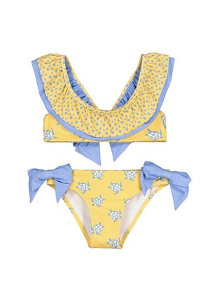 Bikini para niñas en amarillo y azul con estampados de tortugas, escote con volantes en la parte superior y lazos azules en los lados de la parte inferior.