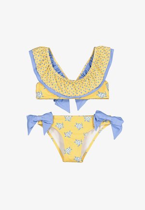 Bikini para niñas en amarillo y azul con estampados de tortugas, escote con volantes en la parte superior y lazos azules en los lados de la parte inferior.