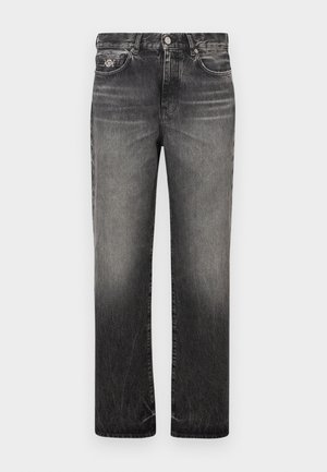 Iznīkušas melnas džinsa bikses ar taisnu kāju dizainu, piecām kabatām un redzamām šuvju detaļām. Aprīkotas ar pogas un rāvējslēdzēja aizdari.