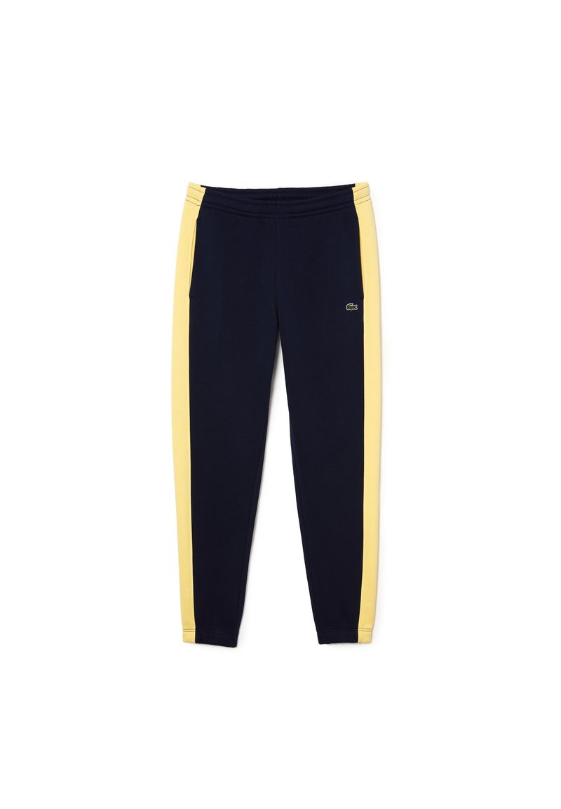 Marineblauwe trainingsbroek met gele zijstrepen, elastische tailleband en een klein geborduurd logo op de linker bovenbeen.