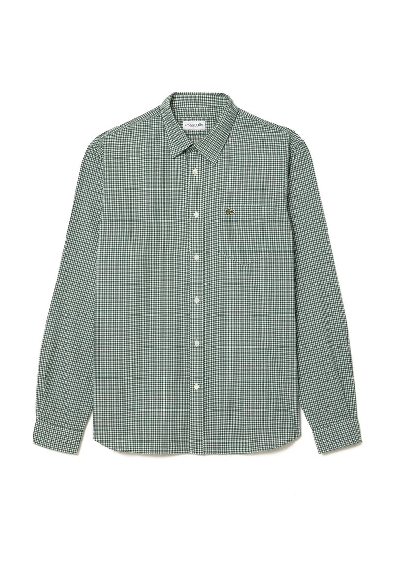 Grün-weiße karierte Langarmbluse mit einem Button-Down-Kragen und einem kleinen Sticklogo auf der linken Brusttasche. Baumwollstoff.