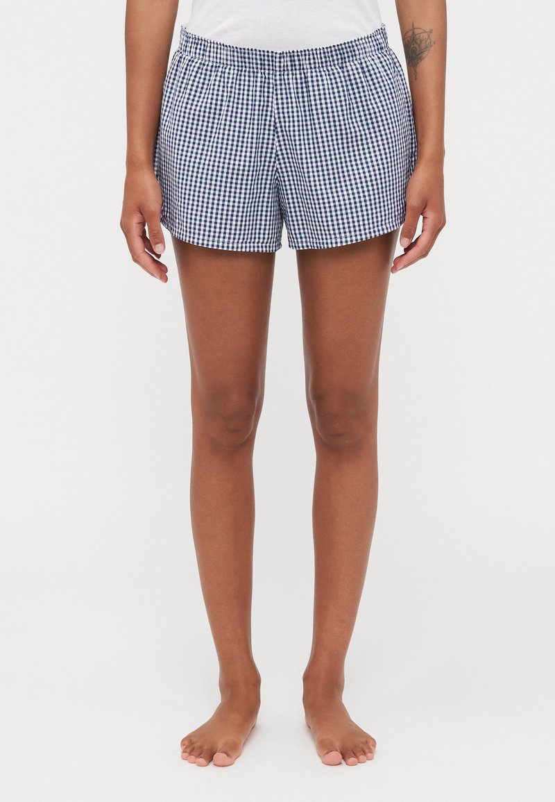 Geruite short met een blauw-witte ruitpatroon, elastische tailleband en een ontspannen pasvorm, gemaakt van lichtgewicht stof.