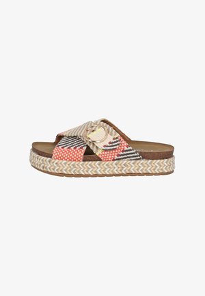 Woven fabric slide sandal with multicolored patterns, round buckle accent, and braided jute-style platform sole. Brown insole.