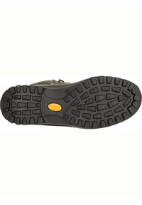 Schwarze Gummilaufsohle mit tiefem Profilmuster, in der Mitte mit einem gelben kreisförmigen Akzent und einer robusten strukturierten Oberfläche für Halt.