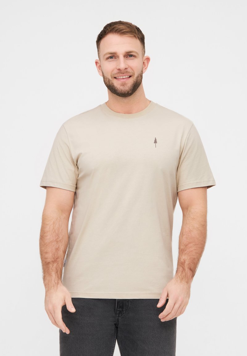 Beige T-Shirt mit kurzen Ärmeln aus Baumwolle. Mit einem kleinen dunkelbraunen Baum-Graphic auf der Brust. Rundhalsausschnitt und lässige Passform.