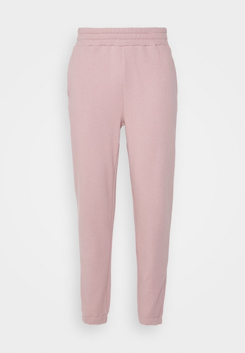 Světle růžové bavlněné tepláky s elastickým pasem, zúženými nohavicemi a žebrovanými manžetami. Obsahují boční kapsy a hladký povrch.