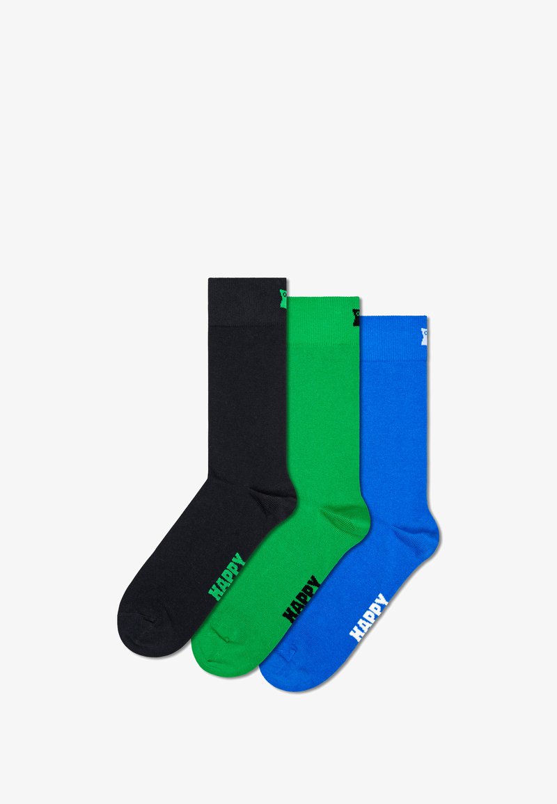 Drie paar katoenen sokken: zwart, groen en blauw. Elke sok heeft een geribde boord en de tekst "HAPPY" in een contrasterende kleur bij de teen.