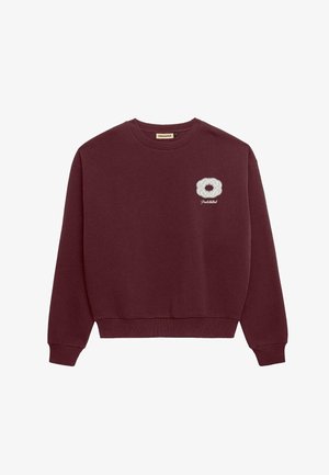 Sweatshirt bordeaux en mélange de coton, avec un col et des poignets côtelés, présentant un design circulaire brodé blanc sur la poitrine.