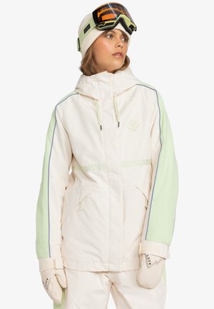 Vit och ljusgrön skidjacka med huva, uppdragna fickor och ribbade manschetter. Inkluderar matchande handskar och skidglasögon. Slät textur.