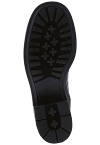 Soletta nera in gomma con un motivo di battistrada unico, caratterizzata da indentazioni a forma di croce e dal marchio "högel". Robusta e progettata per garantire aderenza.