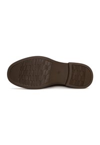 Suela de zapato marrón oscuro con patrones de agarre texturizados y una marca de tamaño 39 en el centro del área del arco.
