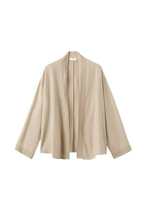Chaqueta beige de frente abierto con mangas largas y sutiles detalles de costura a lo largo de los bordes frontales y los puños de las mangas.