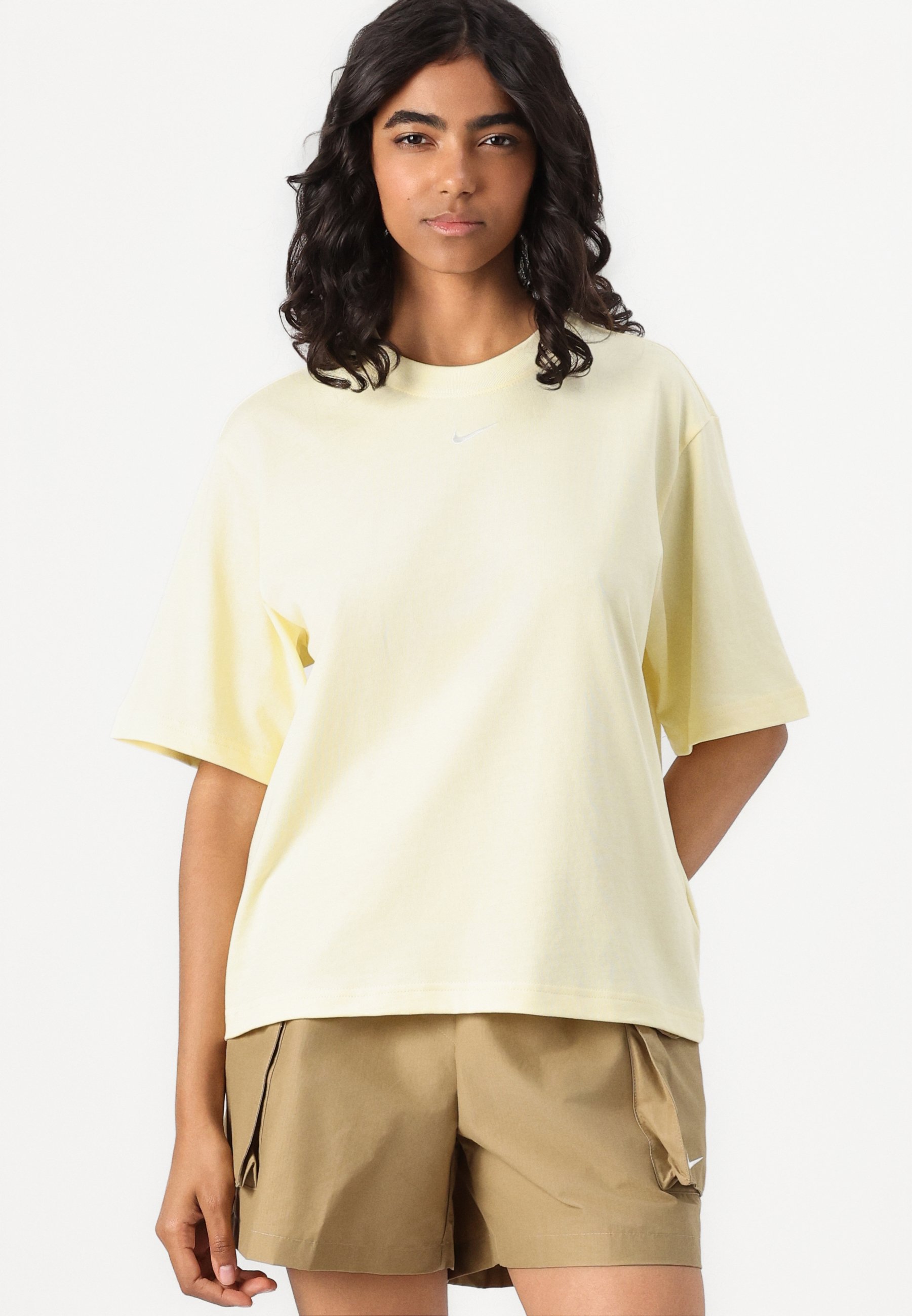 beige nike shorts womens