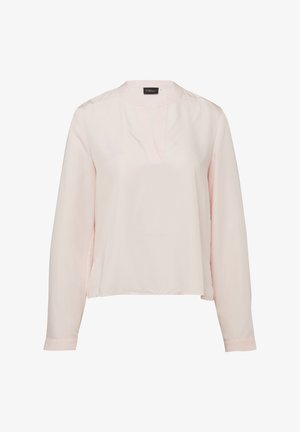 Light pink long-sleeve blouse with a round neckline and a small front V-cut slit, featuring a loose fit and no visible buttons or patterns.