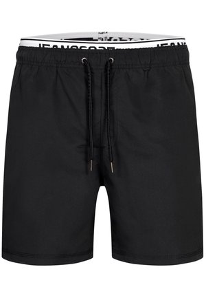 Shorts de bain noirs à cordon avec taille élastique et doublure intérieure blanche de marque visible en haut.
