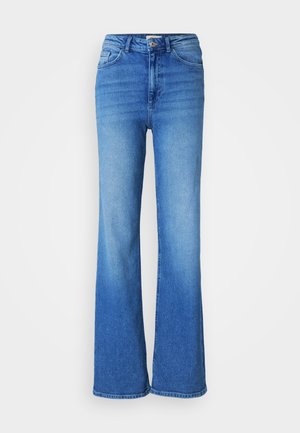 Jean bleu taille haute avec jambes évasées, poches avant et arrière, fermeture par bouton et zip.