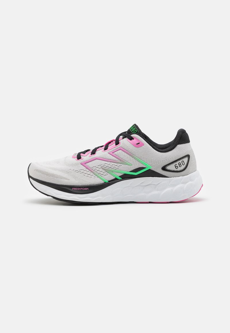 Lightweight running shoe with a grey upper, pink and green accents, and a thick white sole featuring textured patterns, labeled “Fresh Foam.”