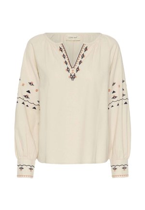 Crème kleurige blouse met lange mouwen, voorzien van een V-hals, geborduurde patronen in marineblauw en perzik, met elastische manchetten en een relaxte pasvorm.