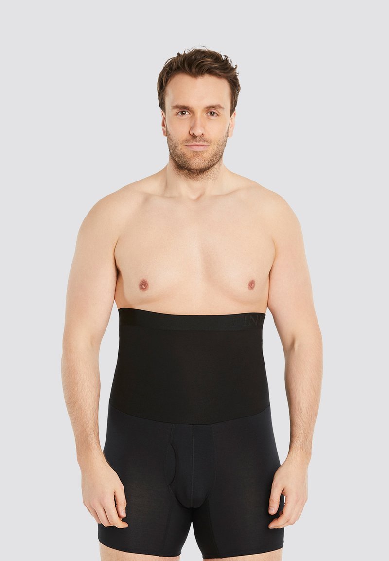Black shapewear featuring a high waistband, smooth texture, and snug fit, designed to provide a streamlined silhouette.