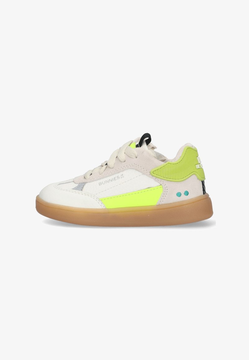 Sneakers with a white leather upper, neon green accents, and a gum rubber sole. Features include laces and a textured panel on the heel.