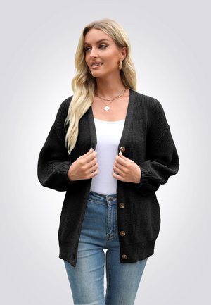 Cardigan nero lavorato a maglia con una vestibilità ampia, scollo a V e maniche a palloncino. Presenta bottoni in legno e polsini e orlo a coste.
