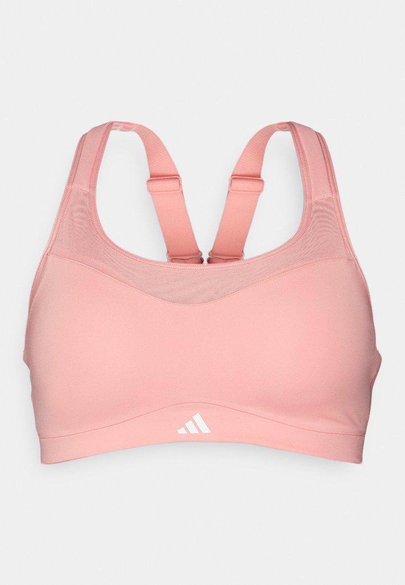 Soutien-gorge de sport rose avec des bretelles réglables, une texture lisse et une conception offrant un bon soutien. Présente un logo en bas à gauche sur le devant.
