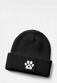 Black beanie with ribbed texture and a folded cuff, featuring a white paw print logo on a rectangular patch.