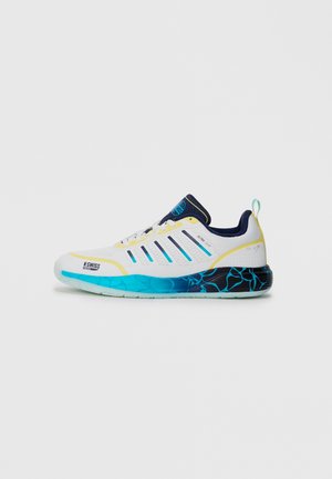 White athletic shoe with blue and yellow accents, textured sole, and a patterned blue gradient on the heel. Features mesh and synthetic materials.