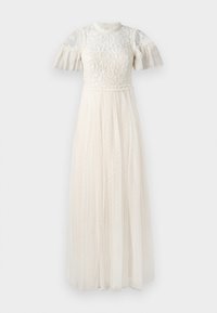 Weißes Kleid mit transparentem, besticktem Oberteil und kurzen, gerafften Ärmeln. Der Rock ist lang und aus leichtem, strukturiertem Stoff mit Polka-Dots gefertigt.