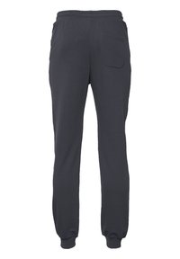 Dunkelgraue Jogginghose aus weichem Material mit einem elastischen Bund, schmal zulaufenden Beinen und einer Gesäßtasche. Flauschige Textur.