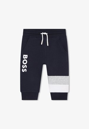 Pantalon de jogging bleu marine pour tout-petits avec cordon blanc, poches avant, texte "BOSS" sur le côté et bloc de couleur gris et blanc sur un bas de jambe.