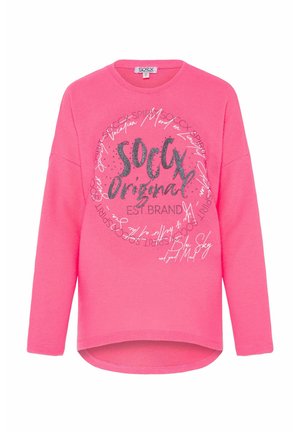 Pink sweatshirt featuring a round neckline, long sleeves, and a high-low hem. Decorated with silver graphic text and curved patterns.