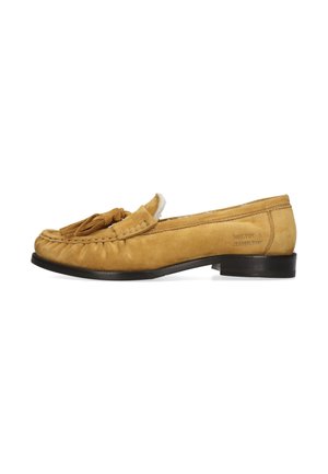 Hellbrauner Veloursleder-Slipper mit Quasten und niedrigem schwarzen Absatz, Seitenansicht mit sichtbaren Nähten und Markennamen an der Ferse.